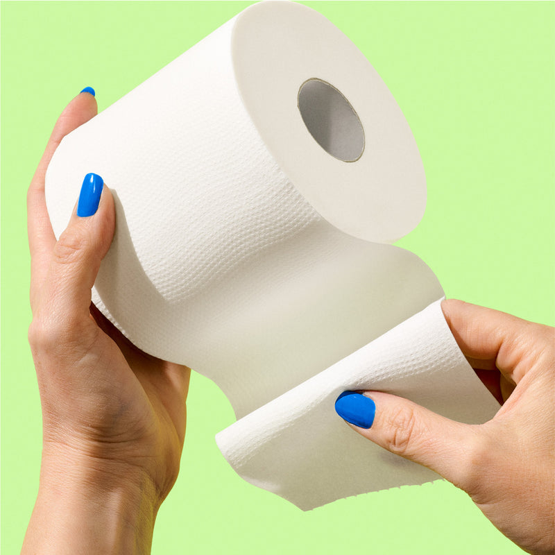 Super soft 3-ply bamboo toilet paper being held.