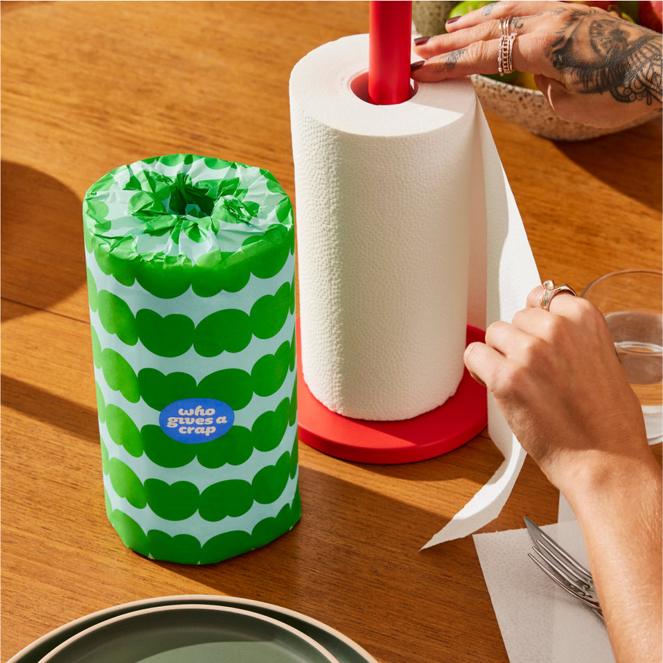 Two rolls of Who Gives a Crap paper towel on kitchen bench