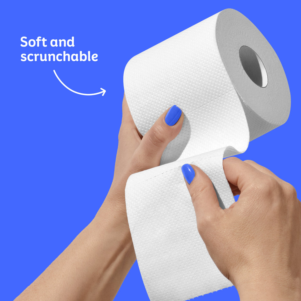 Soft and scrunchable toilet paper roll held with hands